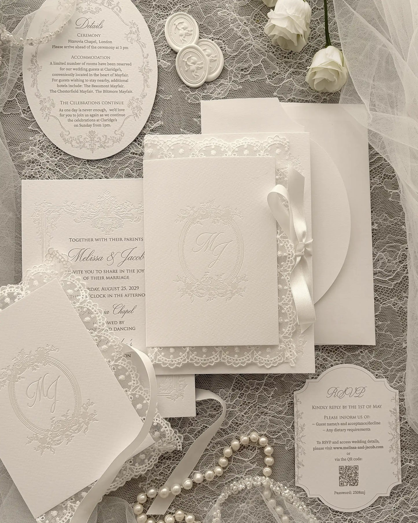 Alyson Lace White wedding invitation with pearl foil-pressed monogram in delicate lace folder, finished with satin ribbon and vintage pearl frame design — Polina Perri.