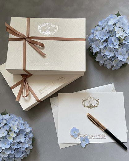 Gold foil monogram wedding thank-you cards tied with satin ribbon, with matching envelope — Polina Perri