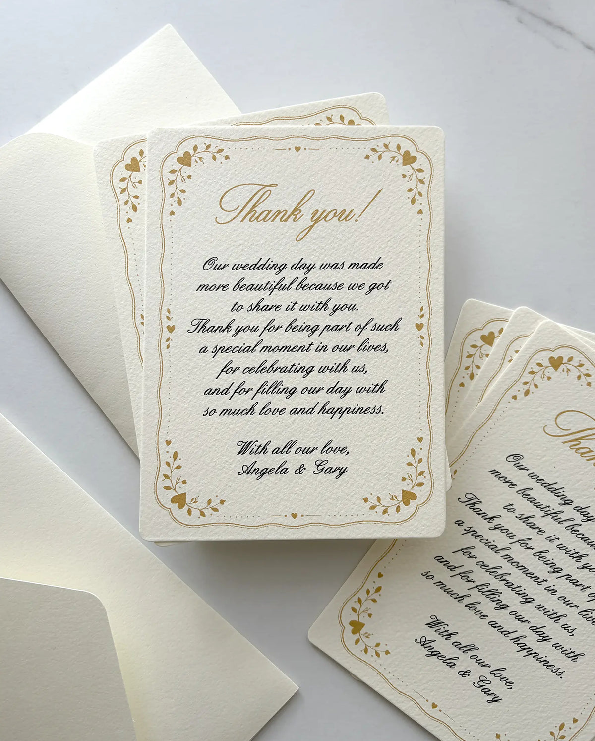 Lovely Frame wedding thank you card with a gold heart and leaf frame and a handwritten-style message, with cream envelopes — Polina Perri