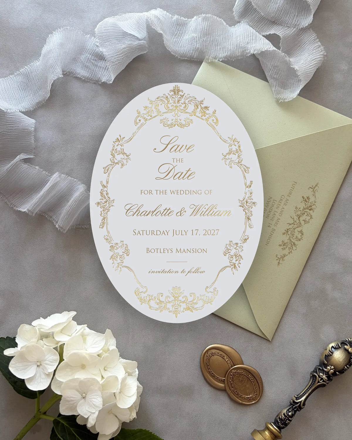 Oval Save the Date Card with Gold Foil Detailing Beside Envelope — Polina Perri