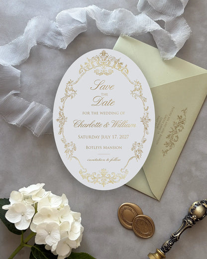 Oval Save the Date Card with Gold Foil Detailing Beside Envelope — Polina Perri