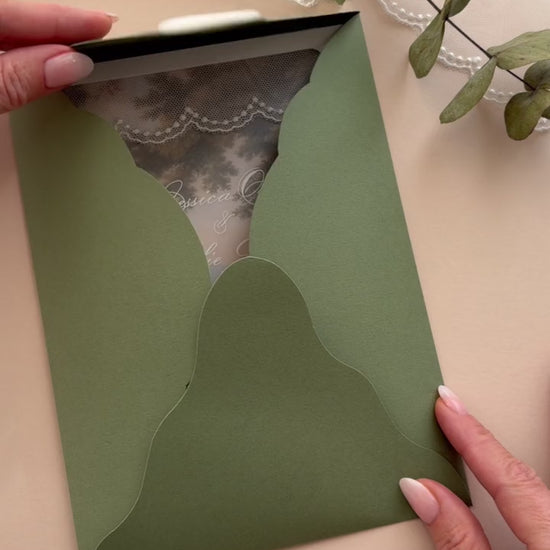 Video of the Florence olive green four-petal folder opening to reveal the vellum lace wedding invitation