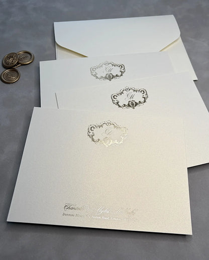 Shimmer thank-you cards with gold foil monogram, matching envelope and gold wax seals