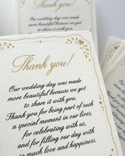 Close-up of the gold "Thank you!" script and handwritten-style message on textured designer paper